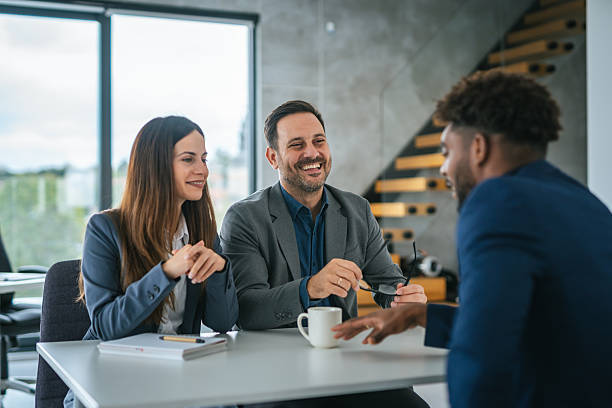 istock Business professionals discussing work at an office meeting 2248869734