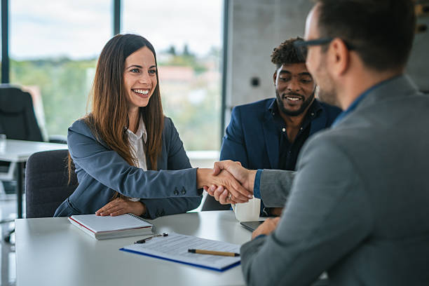 istock Businesswoman shaking hands with client after successful meeting 2248869751