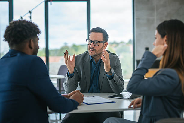 istock Business professional discussing financial contract with clients in office 2248869835
