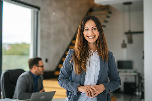 istock Confident young businesswoman standing in modern office environment 2248870581