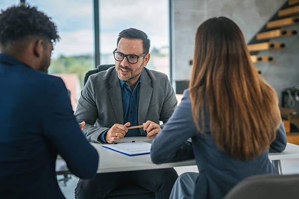 istock Business professional discussing financial contract with clients in office 2248870757