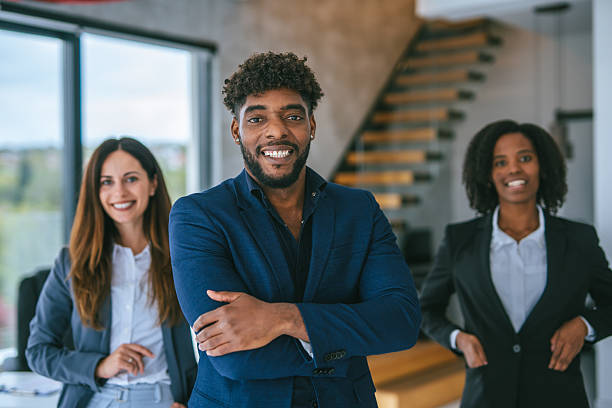 istock Diverse business professionals standing with confidence in modern office 2248870782