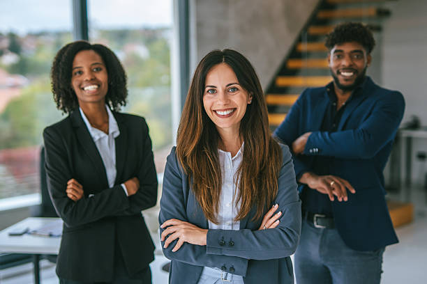 istock Diverse business team smiling confidently in modern office 2248870785