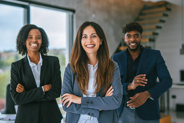 istock Diverse business team smiling confidently in modern office 2248870787