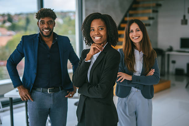 istock Diverse business team smiling confidently in modern office 2248870801