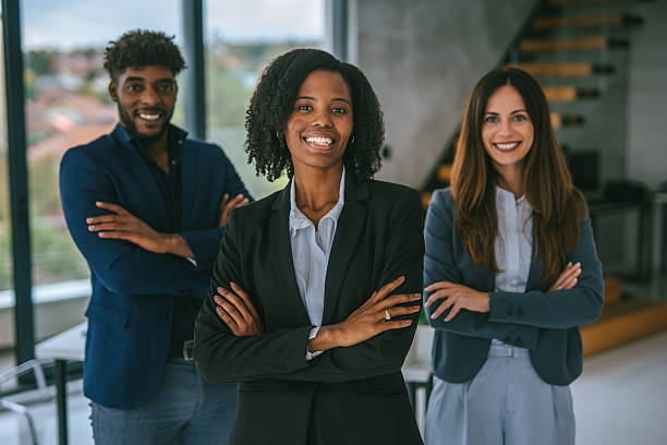 istock Diverse business team smiling with arms crossed in modern office 2248870860