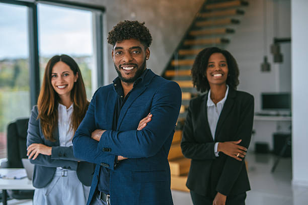 istock Diverse business professionals standing with confidence in modern office 2248870894