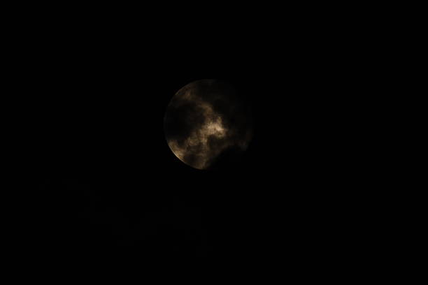 Full moon night with cloudscape and shining stars.
