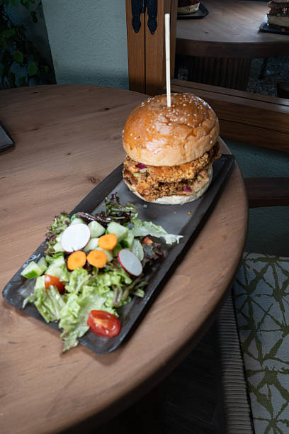 istock Crispy fried chicken burger served with fresh toppings and soft burger bun. 2248881154