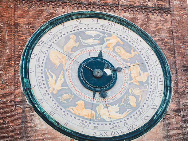Venice, Veneto, Italy: Catholic Church of the Holy Apostles of Christ (Chiesa dei Santi Apostoli di Cristo), detail of the 17th-century campanile with a 24 hour clock face with golden hands and a golden sun at the center. Cannaregio district.