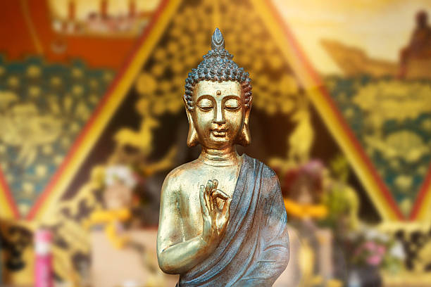 istock Golden Buddha statue with temple background and sunlight 2248881246
