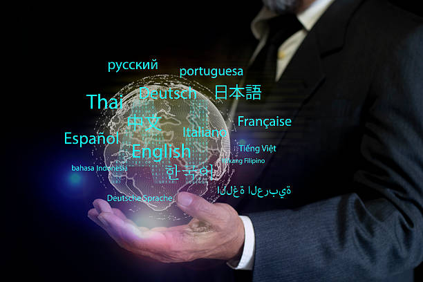 istock Person holds displaying an AI powered language translation app. modern global communication, language learning, AI assistant translation technology with multilingual interface 2248885308