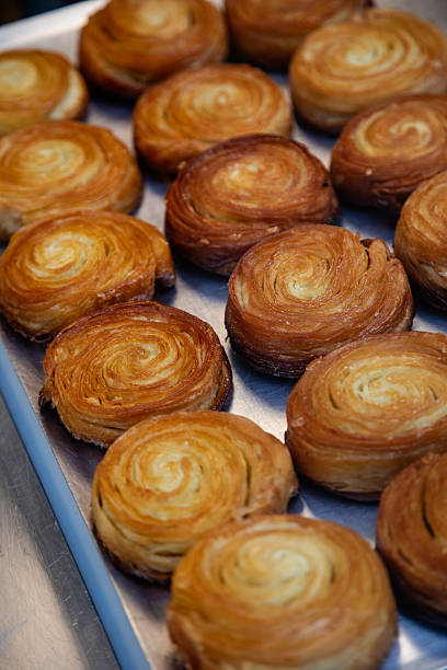 Freshly Baked Kouign-Amann Pastries on Tray in Brittany, France