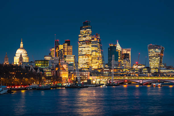 istock London skyline illuminating at dusk with modern buildings along thames river 2248889636