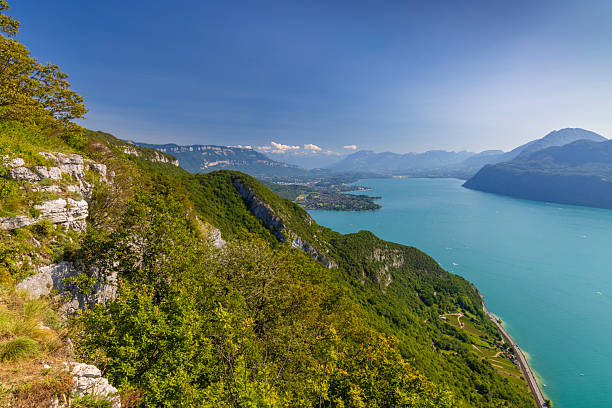 Lake Bourget, green mountains, and blue sky from a high viewpoint in Savoie, France