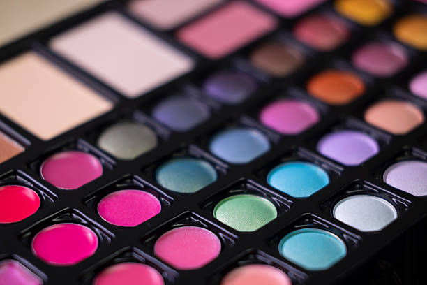 Close up view of a vibrant cosmetic palette offering a wide range of colors