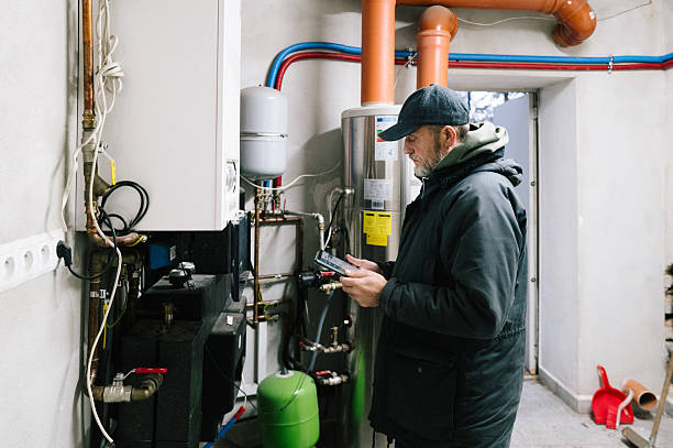 istock A building technician inspects the heating system of a residential building 2248890826