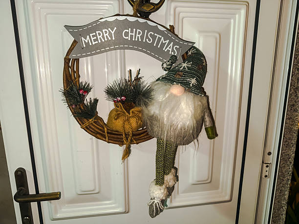 Christmas Wreath with multicolored sound equalizer wave line and flying musical notes against black background.