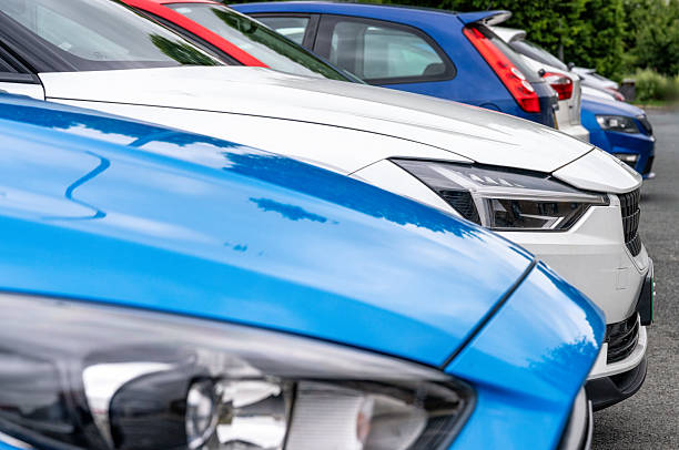 Treforest, Wales - February 2022: Row of second hand cars on sale outside a Vauxhall car dealership
