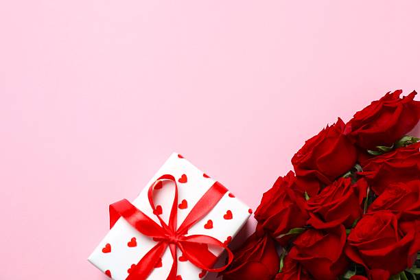 istock Beautiful red roses, gift box and hearts on color background 2248893155