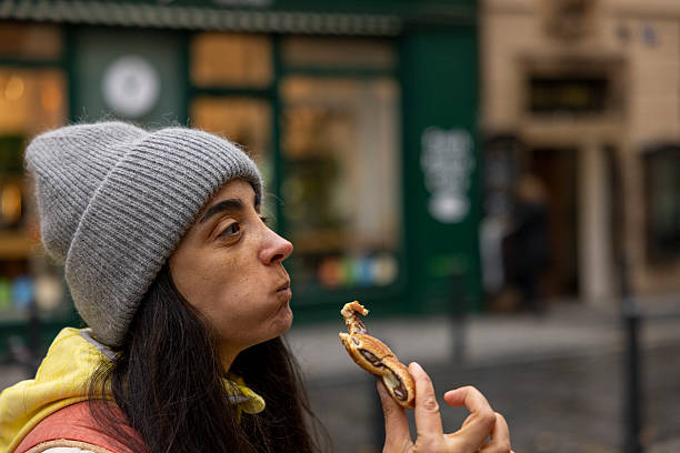 istock woman eating Chimney Cake 2248895084