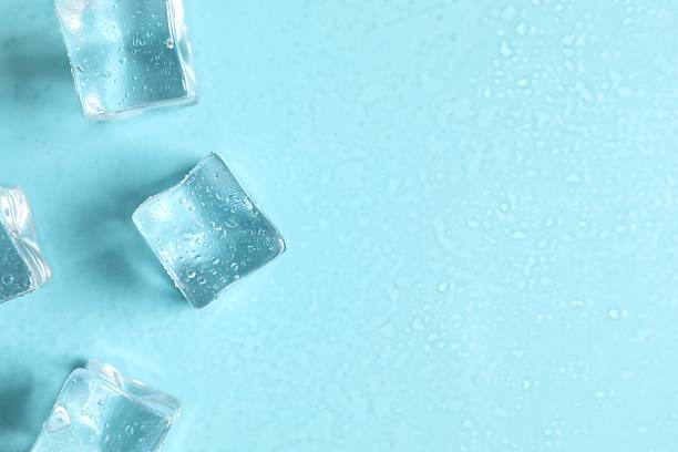istock Sscattered melting ice cubes on blue background, space for text 2248895774