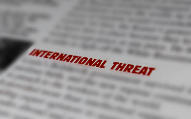istock Close-up of bold text ‘INTERNATIONAL THREAT’ on blurred background 2248896502