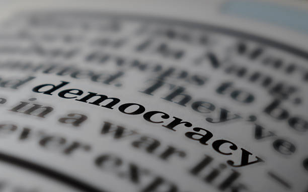 istock Close-up of bold text ‘DEMOCRACY’ on blurred background 2248896542