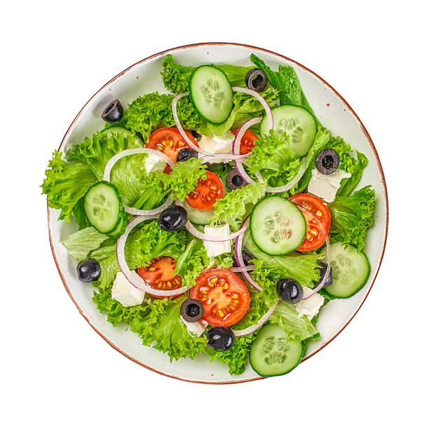 Greek salad with cheese and fresh vegetables isolated on white background,