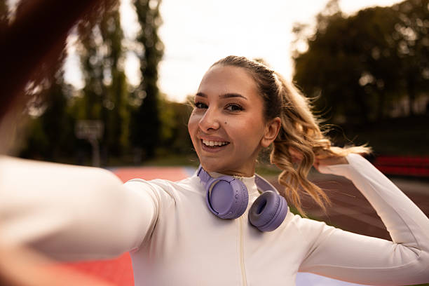 istock Smiling Athlete Female Taking Selfie 2248899129