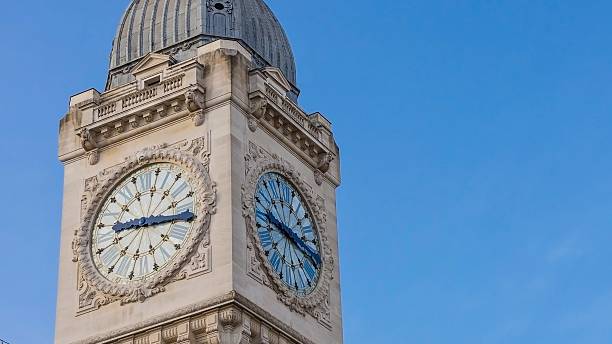 istock Close up of a historic clock tower against a clear blue sky 2248903053