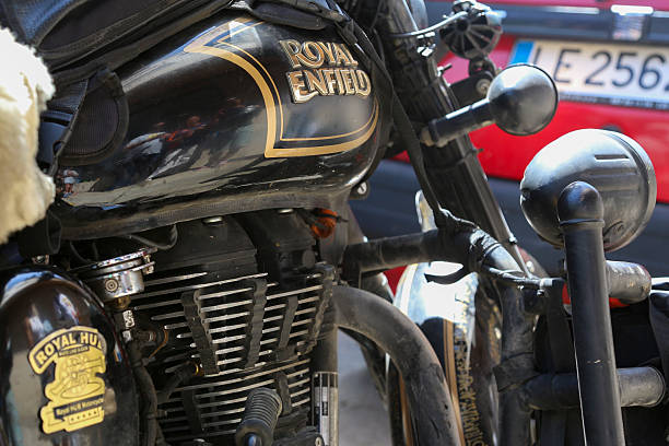 Royal Enfield motorcycle, seemingly the Classic 350cc model, difficult to assess due to the touring customization it has undergone, seen in La Bañeza, Spain
