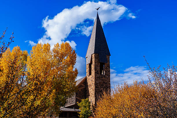 Interfaith chapel with fall colors popular for religious events and weddings in Aspen, Colorado on September 29, 2025. Sunny blue sky day in early morning.