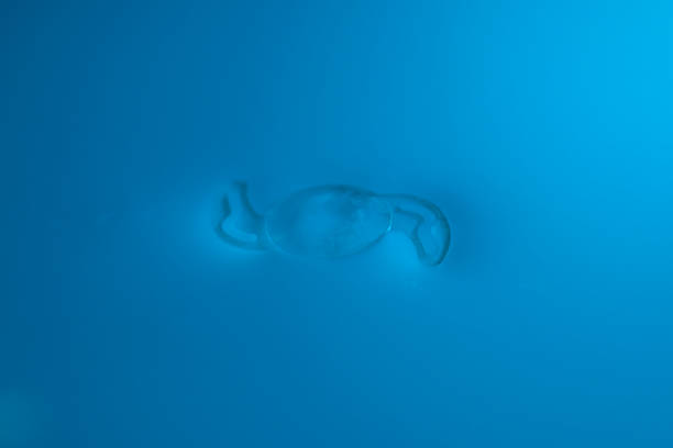A scuba diver's exhaled air travels to the surface of the sea.  Air Bubble Blue sea Underwater sunlight background   Scuba diver point of view