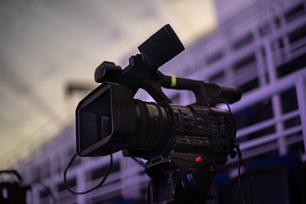 istock Professional video camera on a tripod, ready for filming a live event 2248913441