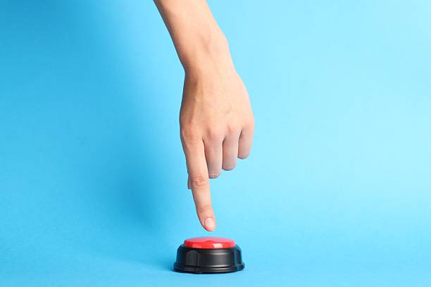 istock Woman pressing red button on light blue background, closeup 2248914190