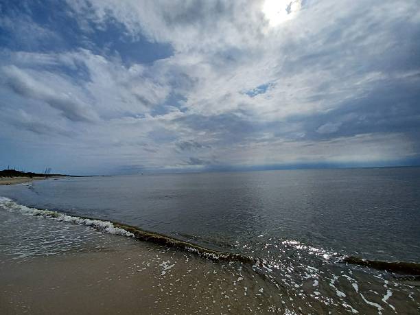 istock Surreal Clouds and Sun on the Bay 2248916384