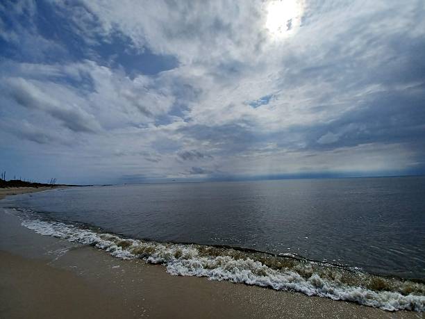 istock Surreal Clouds and Sun on the Bay 2248916390