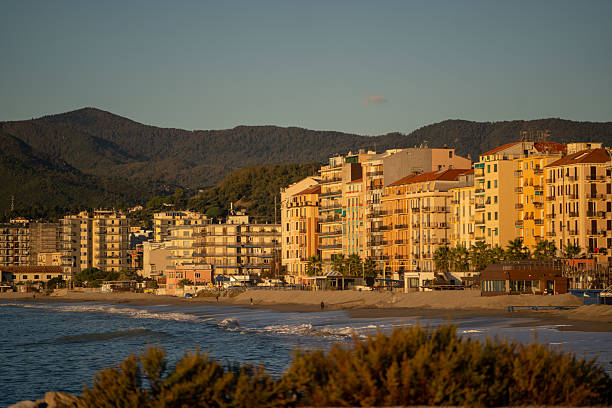 istock vibrant seaside scene showcasing sunlight reflecting off building facades and gentle waves 2248916652