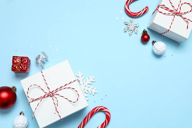 istock Beautiful frame with gift boxes on blue background, Christmas concept 2248918310