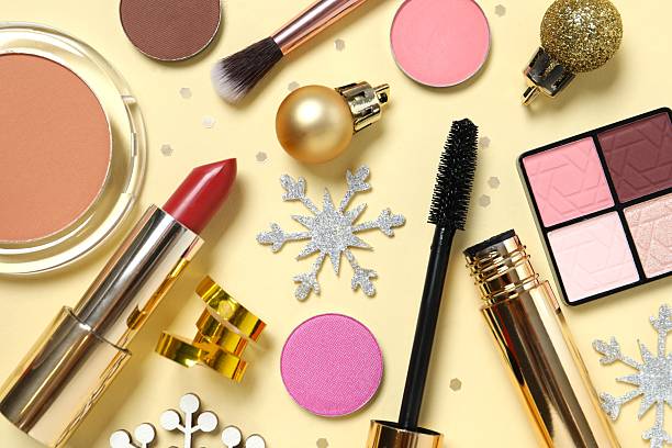 istock Flat lay composition with makeup products and Christmas decor on beige background 2248918481