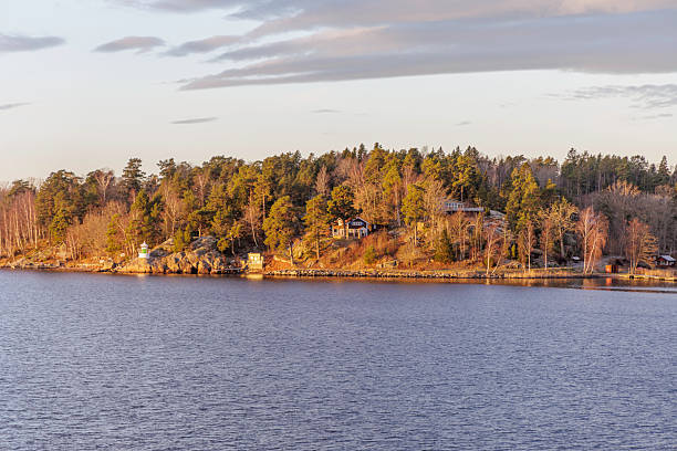 istock Wooded Archipelago Shore with Cottage and Navigation Light 2248921395