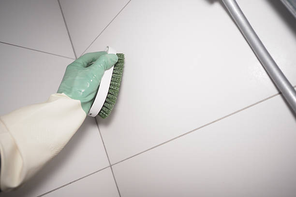 istock Cleaning tiles with a scrub brush in a home interior 2248921689