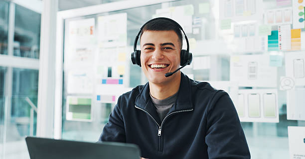 Happy man, portrait and consultant with headset for web help or tech support in office. Male person, agent or smile with mic for virtual assistance, communication or online advice in workplace