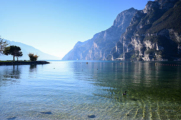istock Lake garda, italy, reflecting blue mountains and clear water 2248923463
