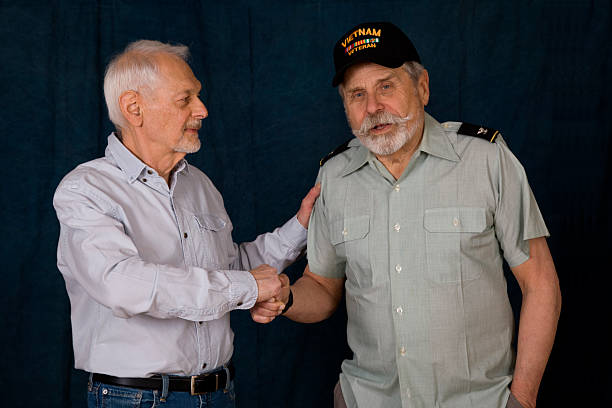 istock Senior man thanking Retired Army Colonel for his service 2248923538