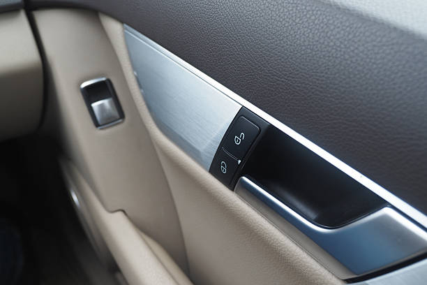 istock Car door panel with controls in a luxury vehicle interior 2248923594