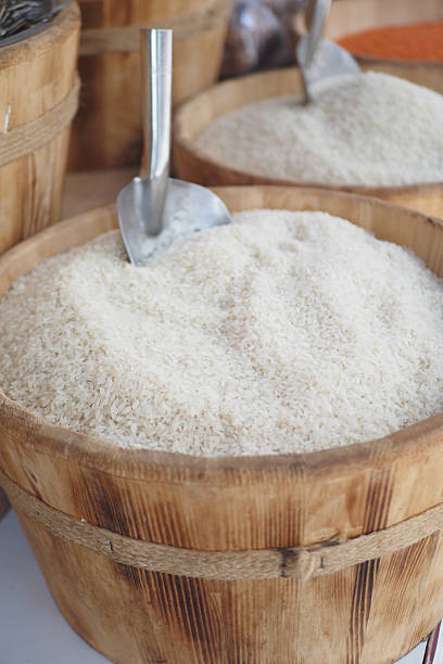 Freshly harvested rice stored in wooden containers