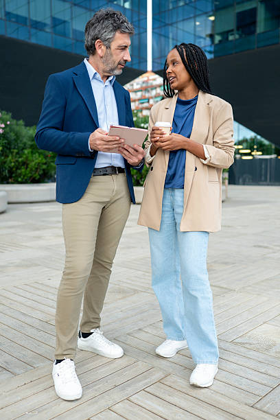 istock Business colleagues discussing work using digital tablet outdoors 2248923848