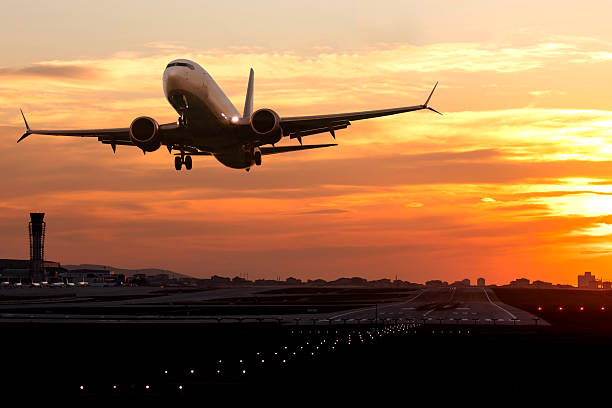 istock Passenger airplane is taking off at sunset 2248924195